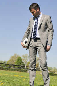 Business man coaching soccer